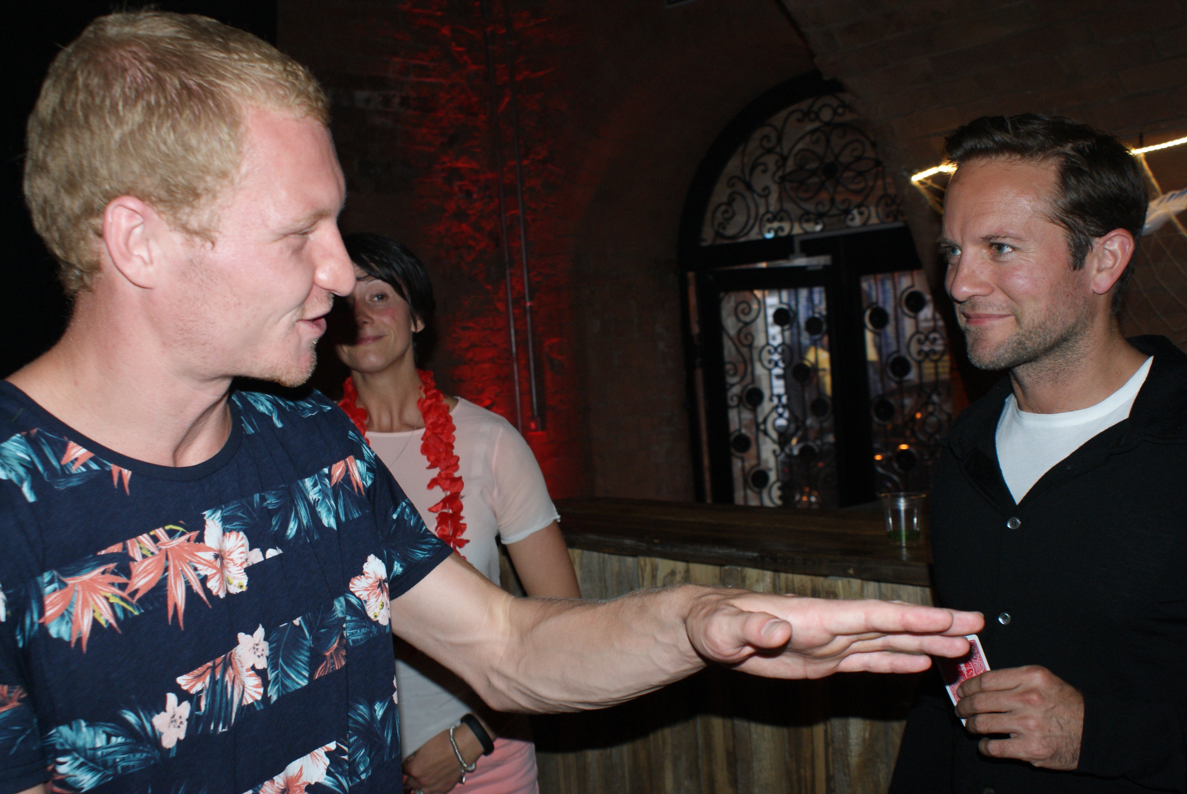Street Magician Liam Walsh performing close up magic for Virgin Media Party in London